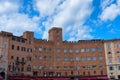 SIENA, ITALY Ã¢â¬â MAY 25, 2017: Campo Square Piazza del Campo, Palazzo Pubblico and Mangia Tower Torre del Mangia. Royalty Free Stock Photo